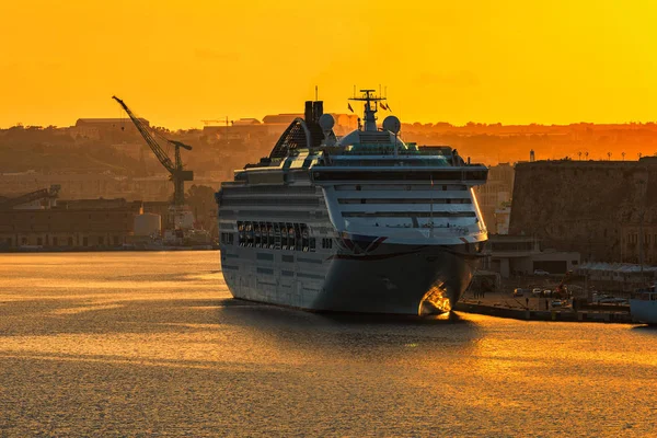 Big cruise ship anchored in the harbor of Valletta, Malta.