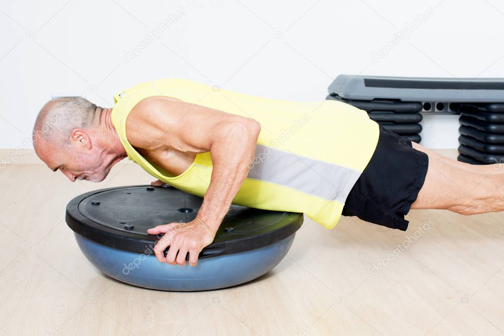 Senior man making push-ups