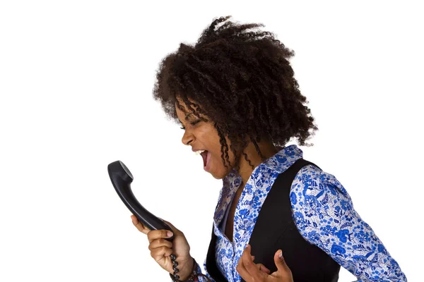 Boos Afrikaanse Amerikaanse vrouw met handset — Stockfoto