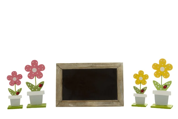 Beautiful flowers and blank blackboard — Stock Photo, Image