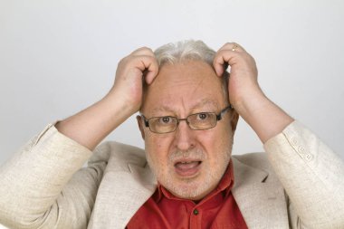 White haired senior with glasses tearing his hair clipart