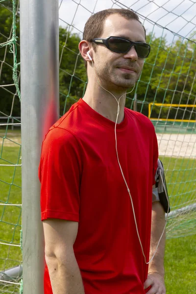 Sportsman with sunglass and earphones — Stockfoto