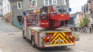 FRANKENBERG, GERMANYX - JULY 15, 2019: Modern Fire Fighter Car with with hydraulic fire escape stands in the pedestrian zone of downtown Frankenberg, Germany