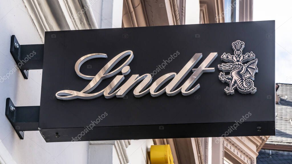 TRIER, GERMANY - SEPTEMBER 13, 2019: Lindt Logo on a House Facade on a retail shop in TRIER, GERMANY.   The brand is one of the most important in chocolates