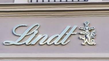 TRIER, GERMANY - SEPTEMBER 13, 2019: Lindt Logo on a House Facade on a retail shop in TRIER, GERMANY.   The brand is one of the most important in chocolates