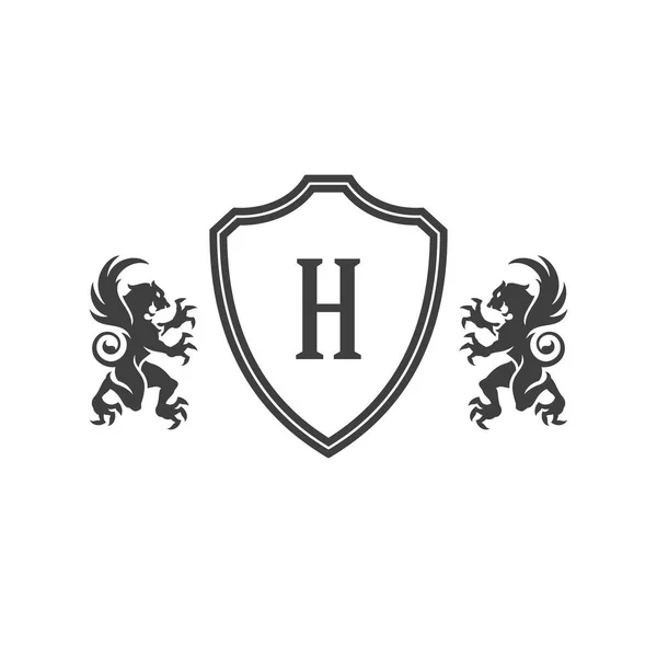 Heraldische leeuwen en monogram op schild geïsoleerd op witte achtergrond — Stockvector