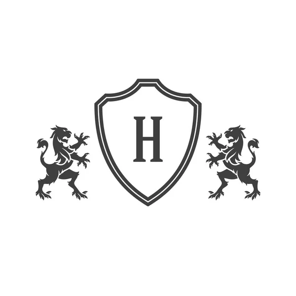 Leones heráldicos y monograma en escudo Aislado sobre fondo blanco — Vector de stock
