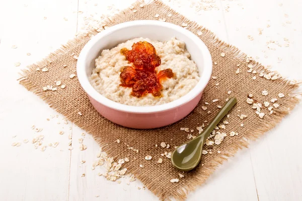 Fresh made porridge with double cream and orange marmalade — Stock Photo, Image