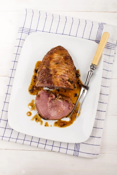 Roasted wild boar served on a porcelain plate — Stock Photo, Image