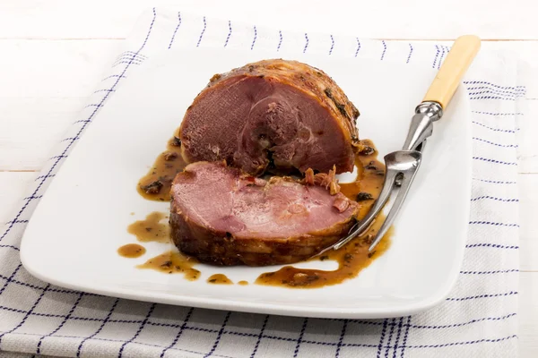 Roasted wild boar served on a porcelain plate — Stock Photo, Image