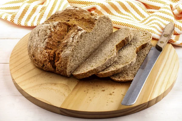 Sliced irish soda bread on a wooden plate — Stock Photo, Image