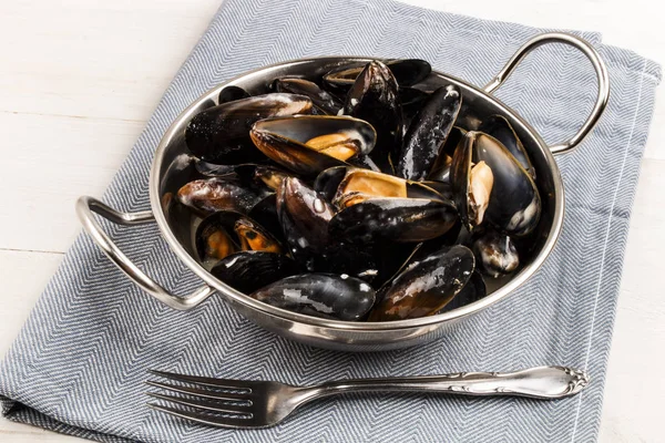 Boiled mussels in a metal bowl — Stock Photo, Image