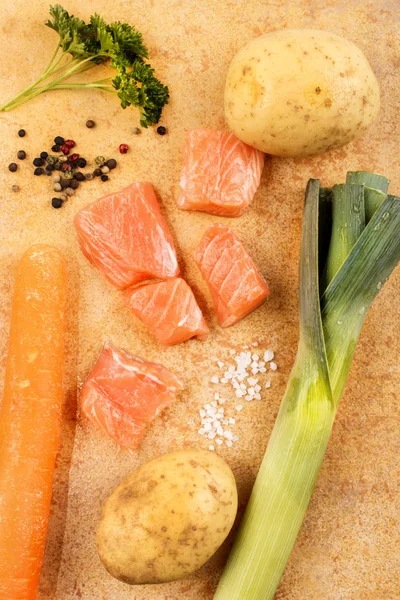 Salmon chunks and vegetable to make fish soup — Stock Photo, Image