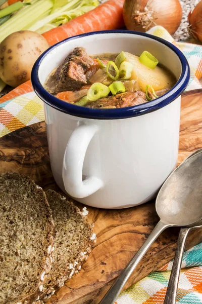 Traditional irish lamb stew with potato, carrot, celery and spr — Stock Photo, Image