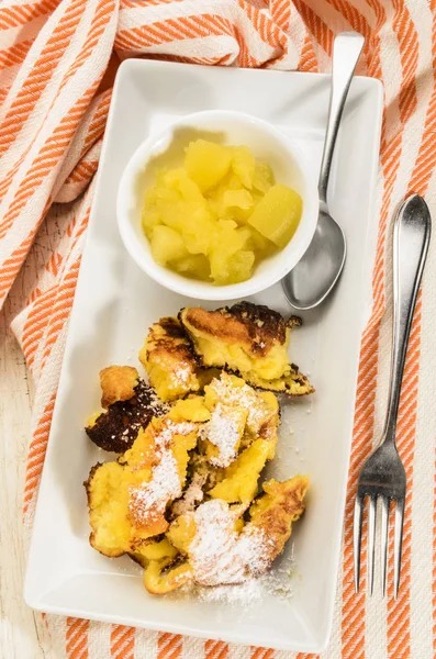 Kaiserschmarrn, served with homemade apple compote and powdered — Stock Photo, Image