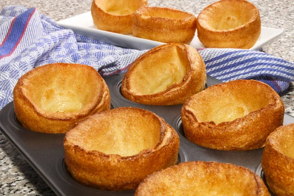 Freshly baked yorkshire pudding in a baking tray — Stock Photo, Image