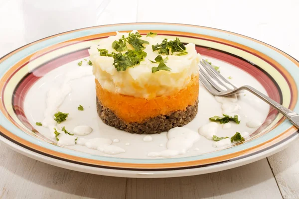 Haggis with mashed potato and turnips on a plate — Stock Photo, Image