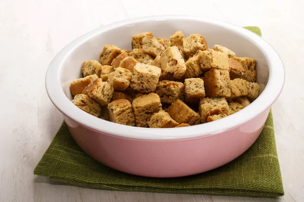 Oven baked croutons in a bowl — Stock Photo, Image