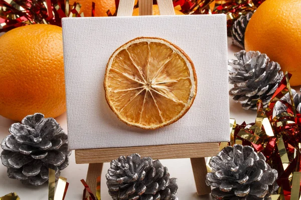 Dried orange slice on a easel as a christmas motive — Stock Photo, Image