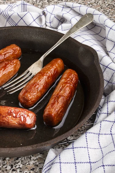 Grilled irish pork sausages in a pan — Stock Photo, Image
