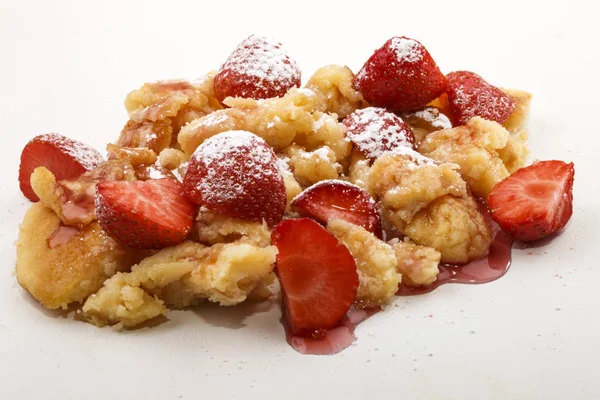 Kaiserschmarrn with strawberry and sauce on a plate — Stock Photo, Image