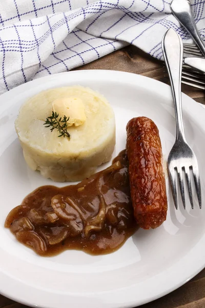 Irish banger and mash with thyme on a plate — Stock Photo, Image