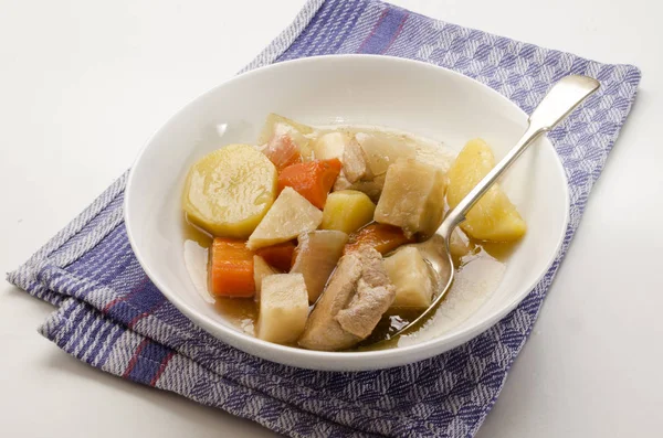 Classic irish stew with a spoon and deep plate — Stock Photo, Image