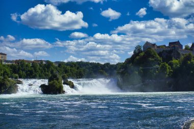the famous rhine falls in the swiss near the city of Schaffhausen - sunny day and blue sky clipart