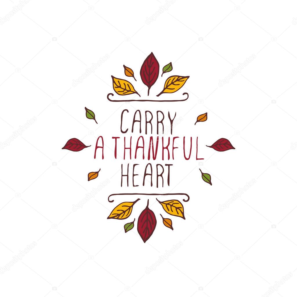 Handdrawn thanksgiving label with leaves and text on white background. Carry a thankful heart.