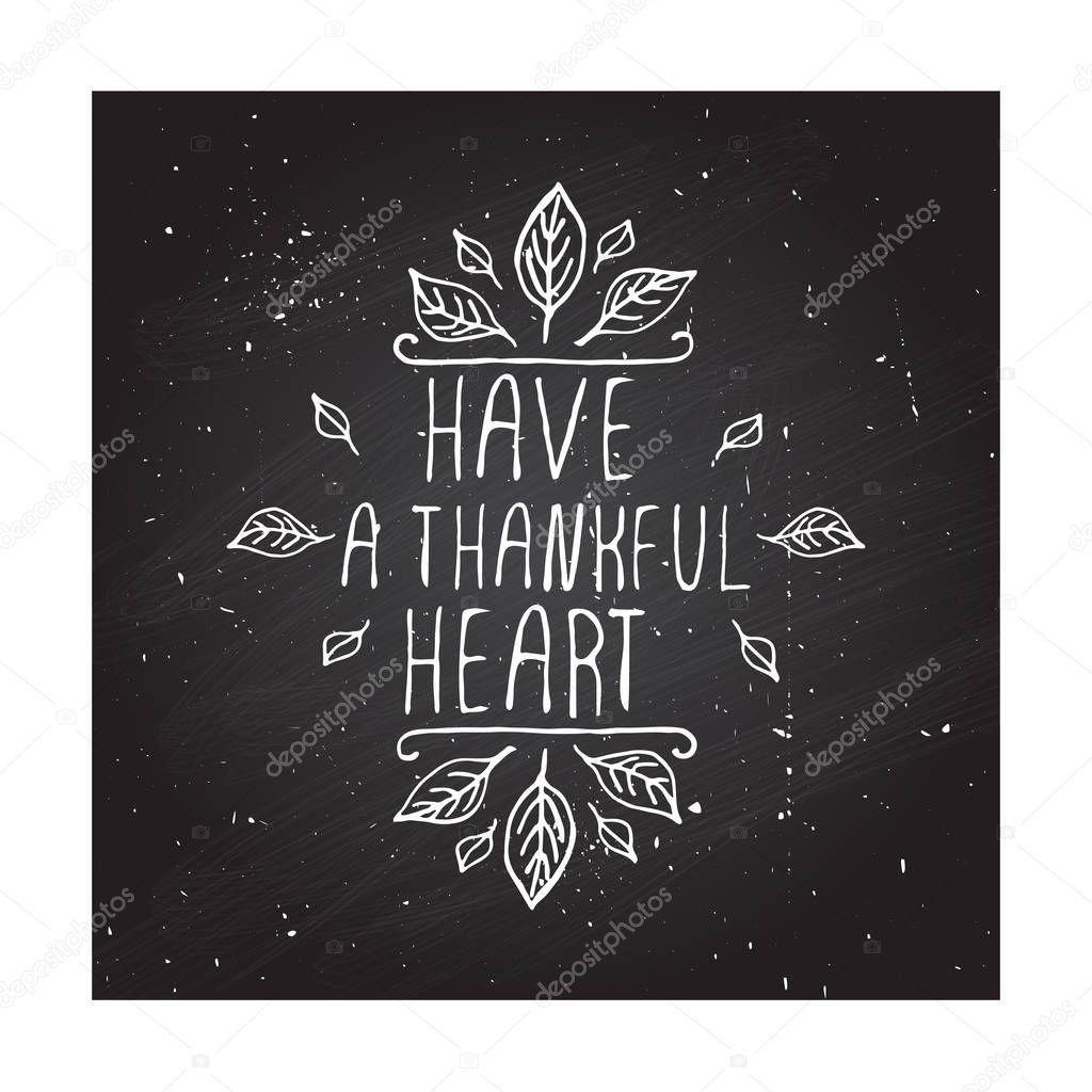 Handdrawn thanksgiving label with leaves and text on chalkboard background. Have a thankful heart.