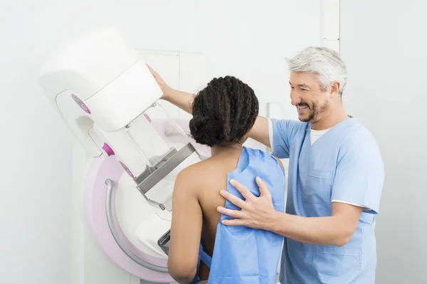 Happy Doctor Assisting Patient Undergoing Mammogram Test — Stock Photo, Image