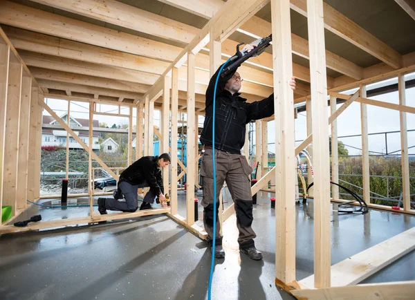 Professional Carpenters Drilling Wood At Site — Stock Photo, Image