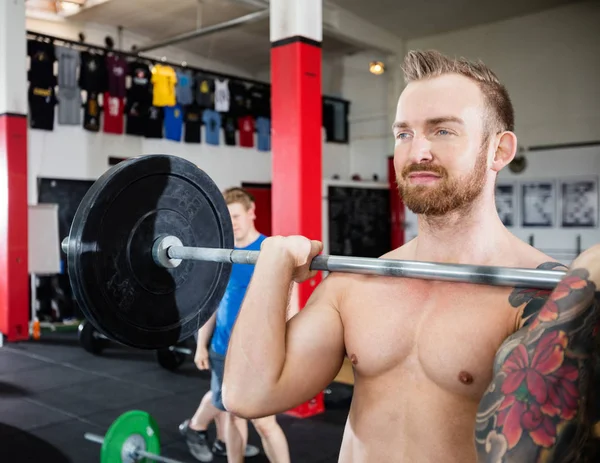 Proud Shirtless Instructor Lifting Barbell — Stock Photo, Image