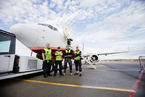 Confident Ground Crew Standing Arms Crossed Against Airplane — Stock Photo, Image