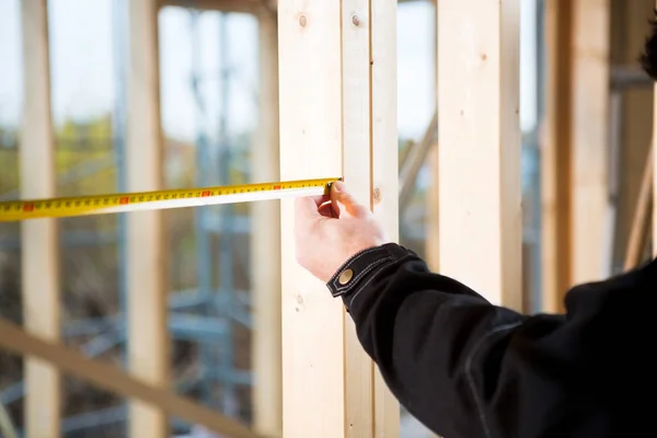 Cropped Image Of Carpenter Measuring Wood At Site — Stock Photo, Image