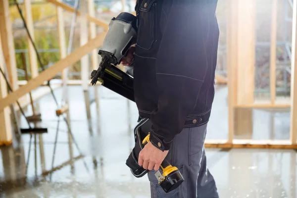 Midsection Of Carpenter With Drill Machines At Site — Stock Photo, Image