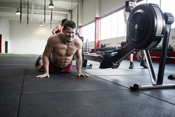 Determined Man Practicing Pushups In Gym Stock Photo