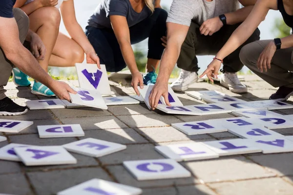 Low Section Of Business Coworker Solving Crossword Puzzle Royalty Free Stock Photos