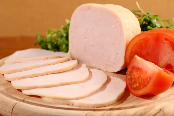 Sliced chicken ham with vegetables. — Stockfoto