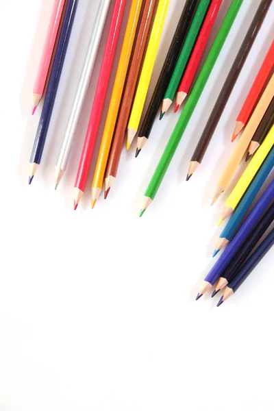 Colored pencils lie in a row — 스톡 사진