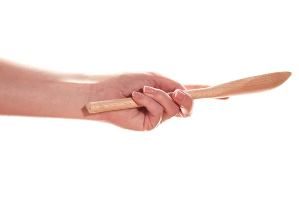 Mano Femenina Sostiene Una Cuchara Madera Aislado Sobre Fondo Blanco —  Fotos de Stock