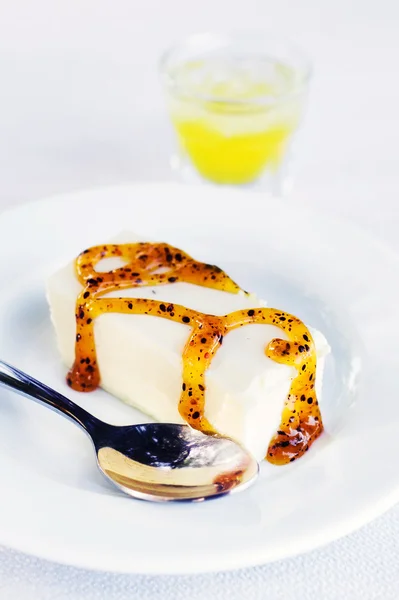 Greek yogurt panna cotta with fruit syrup and lemon liquor (selective focus) — Stock Photo, Image