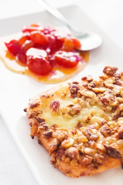 Greek fried cheese (saganaki) with cherry tomato jam (selective focus) — Stock Photo, Image