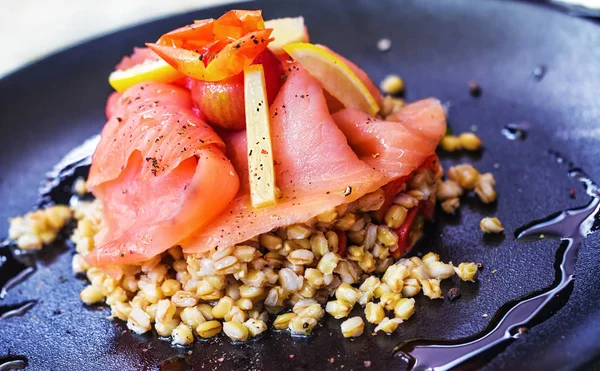 Cretan dish - chickpeas and smoked salmon (selective focus)