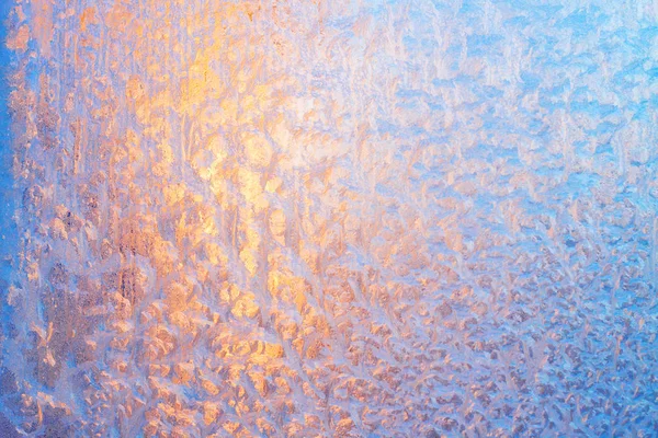 Colorful abstract pattern made by the sun shining through a frosty window — Stock Photo, Image