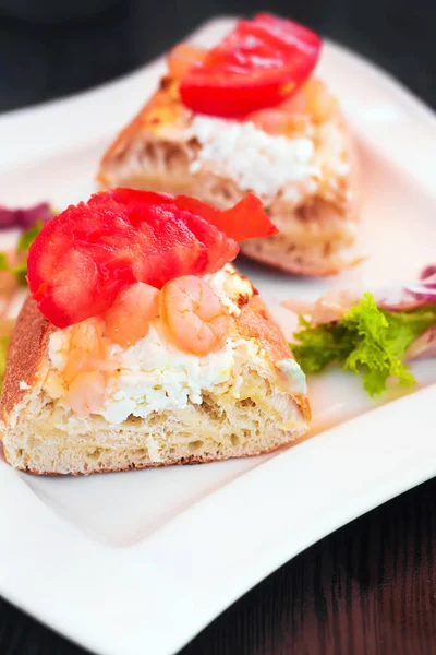 Close up of a cream cheese and shrimp bruschetta, selective focus — Stock Photo, Image