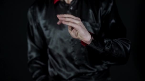 The coin disappears from the magicians hands and smoke coming out of his hand — Stock Video