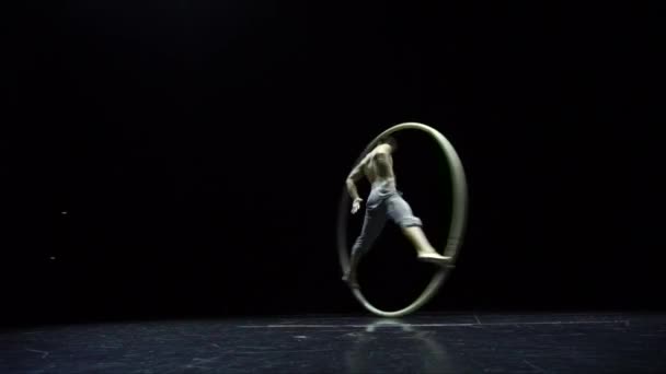 Muscular circus artist in the Cyr Wheel doing difficult tricks slow motion. Concept of concentration and balance — 비디오