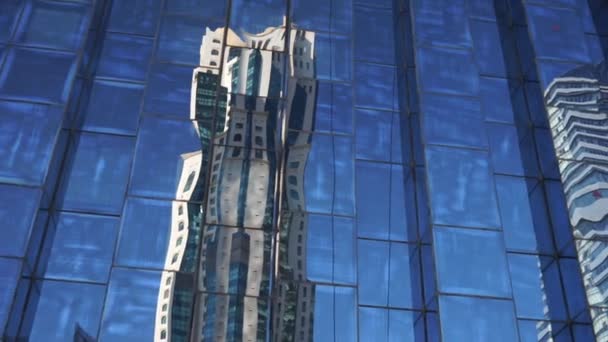 Reflection in the huge skyscraper of tall business centers. Concept of business and financial. — 비디오