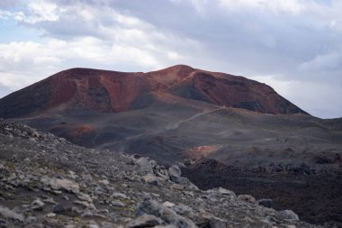 Volcanic landscape with red geological formation on the Fimmvorduhals hiking trail. Iceland clipart